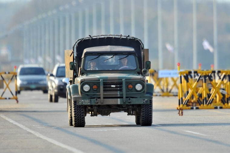 A South Korean military vehicle drives past barricades on the road leading to North Korea's Kaesong industrial complex on Friday.