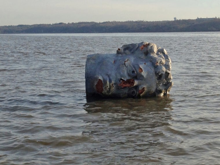A giant foam head floats on the Hudson River in Poughkeepsie, N.Y., on Monday, April 22.