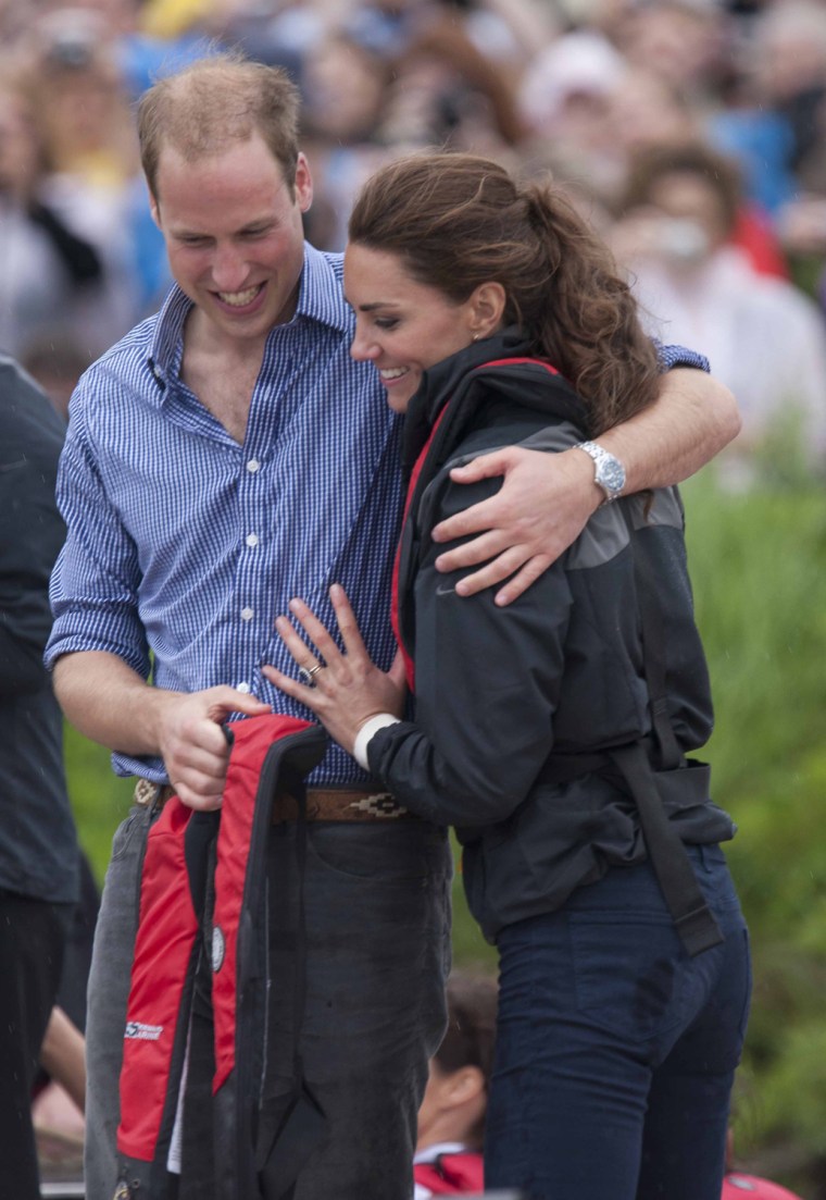 CHARLOTTETOWN, PE - JULY 04:  (NO UK SALES FOR 28 DAYS) Prince William, Duke of Cambridge and Catherine, Duchess of Cambridge hug after taking part in...