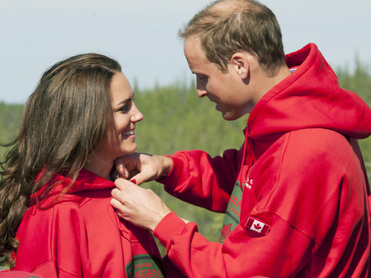 BLACHFORD LAKE, NT - JULY 05: Prince William, Duke of Cambridge and  Catherine, Duchess of Cambridge try on red jackets as they visit the Canadian Ran...
