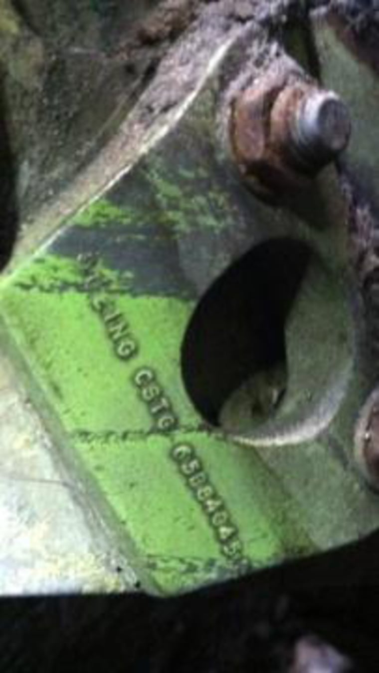 The name Boeing and a serial number is visible on what could be a piece of landing gear from one of the commercial airliners destroyed on Sept. 11, 2001. The piece was discovered wedged between two buildings in lower Manhattan.