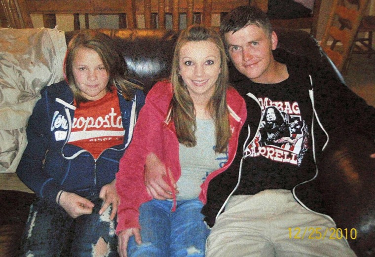 Thirteen-year-old Hailey Dunn (left) poses for a photo with her mother Billie Jean Dunn and her mother's boyfriend Shawn Adkins on Dec. 25, 2010, in Colorado City, Texas. Authorities in West Texas on Friday confirmed the remains found in a remote part of Scurry County in March are those of Hailey Dunn, who has been missing for more than two years.