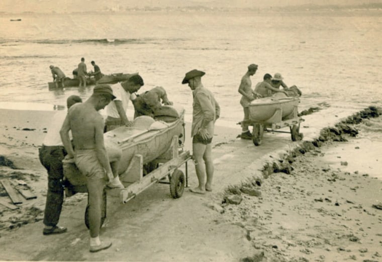 \"Sleeping Beauty\" submersible canoes being launched by OSS (Office of Strategic Services) Maritime Unit personnel, the forefathers of today's CIA and Navy SEAL Teams. Here the mini submersible is launched during training operations in the Pacific Theater during the 1940's.