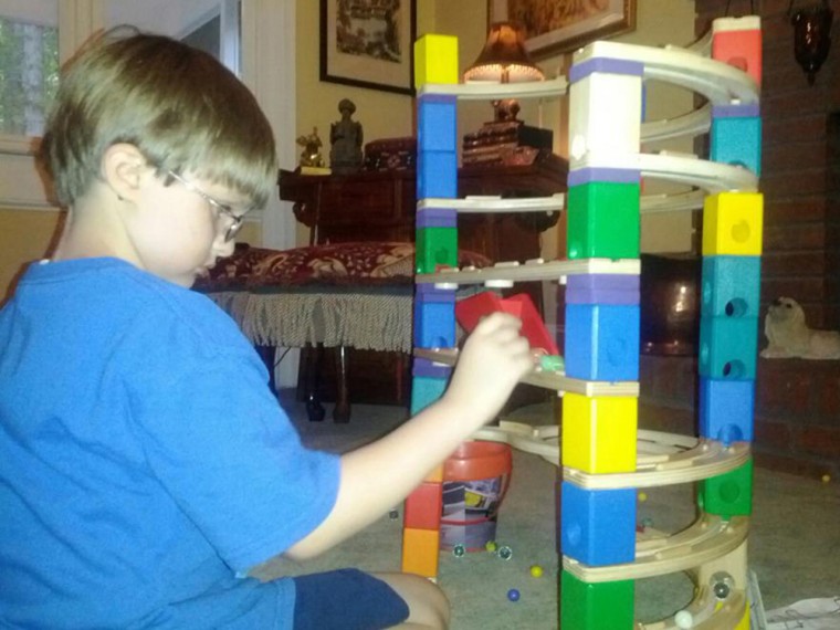 Image: Jonny Hickey playing with marbles