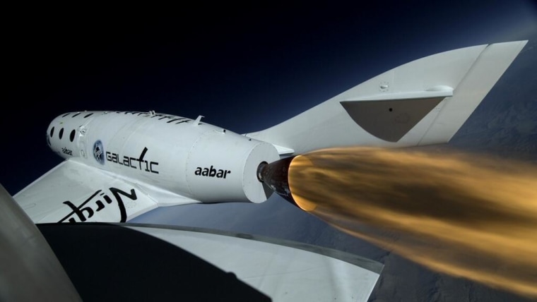 A boom camera on Virgin Galactic's SpaceShipTwo plane shows the rocket engine firing.