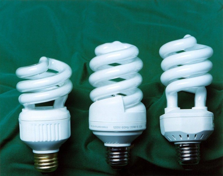 Compact fluorescent light bulbs such as those shown here are more energy efficient than incandescent bulbs. To sell them broadly, new research suggests, skip mention of their environmental benefits.