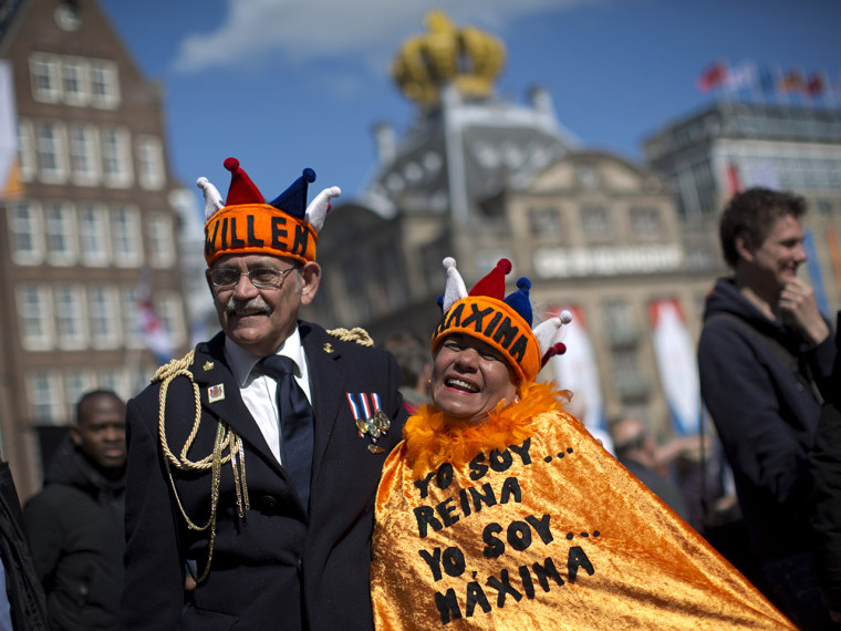 Couple Reina Reyes and Asdrubal Medina  from Venezuela pose for a photograph outside the Royal Palace in downtown Amsterdam, in downtown Amsterdam, Ne...