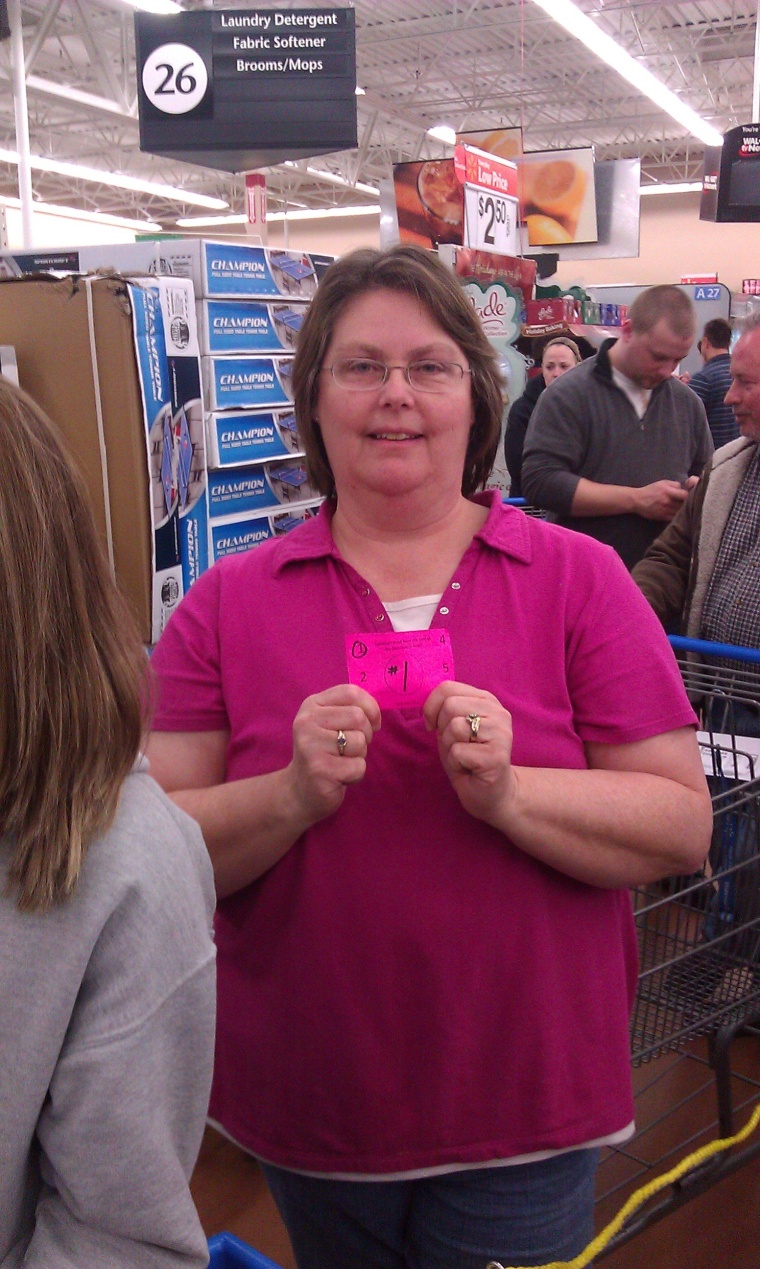 Anna Staab gets her ticket at Walmart for a $199 Xbox with Kinect and a $50 gift certificate.
