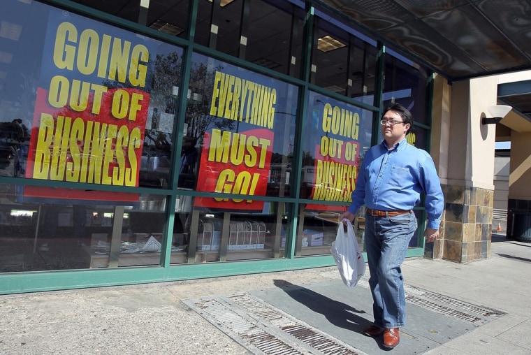 A customer walks by a Borders outlet in San Francisco last week. Borders has begun a liquidation sale, but the bargains so far appear to be limited.