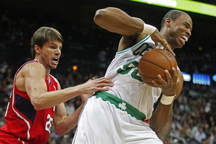 Boston Celtics center Jason Collins (R), grabs a rebound away from Atlanta Hawks guard Kyle Korver in the first half of their NBA basketball game in A...