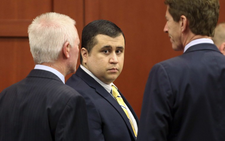 George Zimmerman, defendant in the killing of Trayvon Martin, stands in court in Sanford, Fla., with his attorney Mark O'Mara.