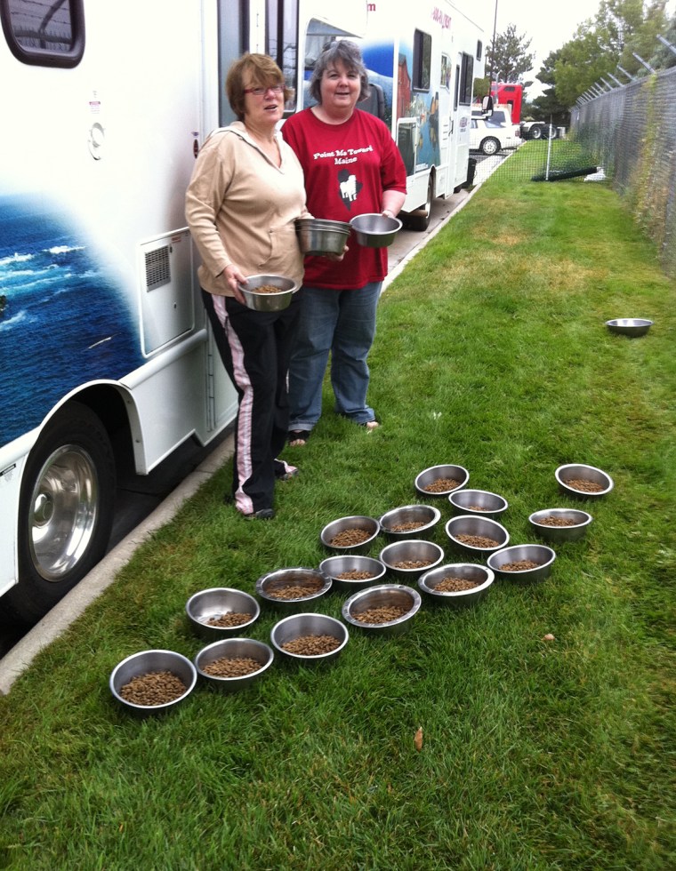 Image: Cyndi Flores and Terri Nigro preparing food for the dogs.