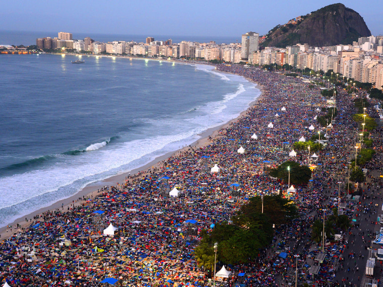Crowds gather on Copacabana beach in Rio de Janeiro for the final mass of the pope's week-long visit.