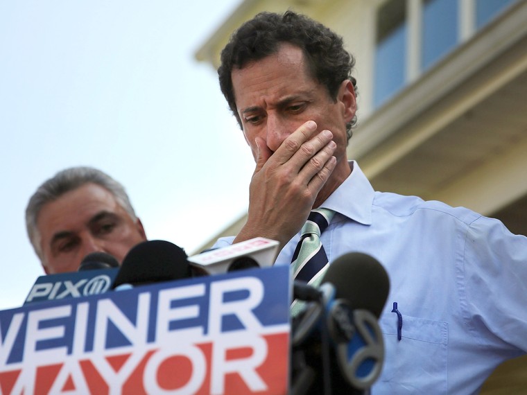 Anthony Weiner pauses while speaking with reporters in Staten Island on a visit to homes damaged by Hurricane Sandy on July 26, 2013.