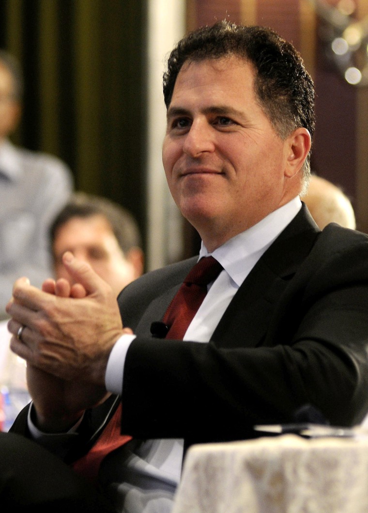 (FILES) CEO of Dell Inc, Michael Dell applauds after a speaker's address while taking part in an interactive session organised by the Confederation of...