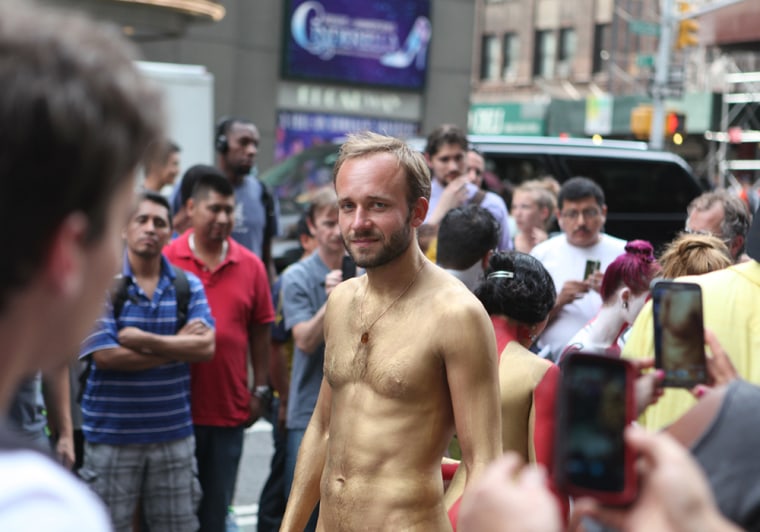 Kirill, a nudist, participates in a public body painting event by artist Andy Golub near New York's Times Square on July 31, 2013.