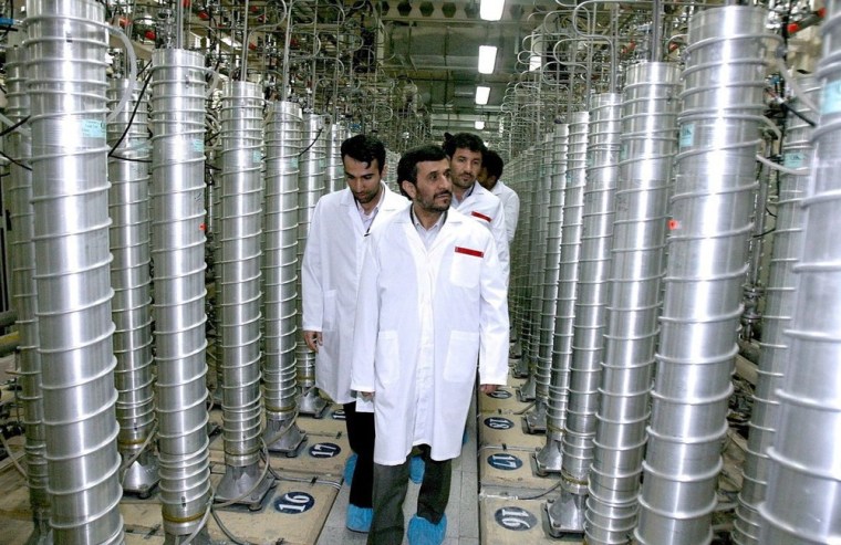 A photo released by the office of Iranian President Mahmoud Ahmadinejad shows him inspecting the Natanz nuclear plant in central Iran on March 8, 2007.