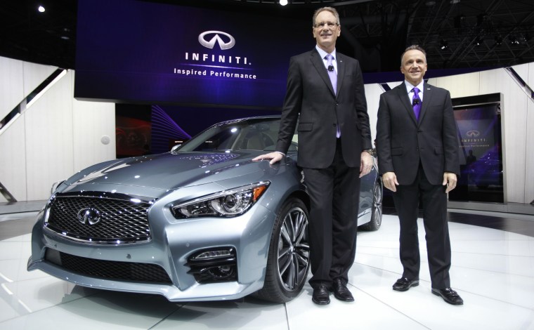 Johan De Nysschen, president of Infiniti Motor Motor Company, and Ben Poore, president of Infiniti Americas pose with the Infiniti.
