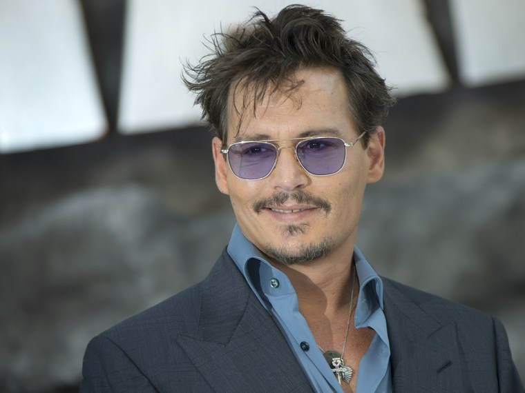 Johnny Depp arrives at a central London cinema for the UK premiere of The Lone Ranger in Leicester Square, Sunday, July 21, 2013. (Photo by Joel Ryan/...