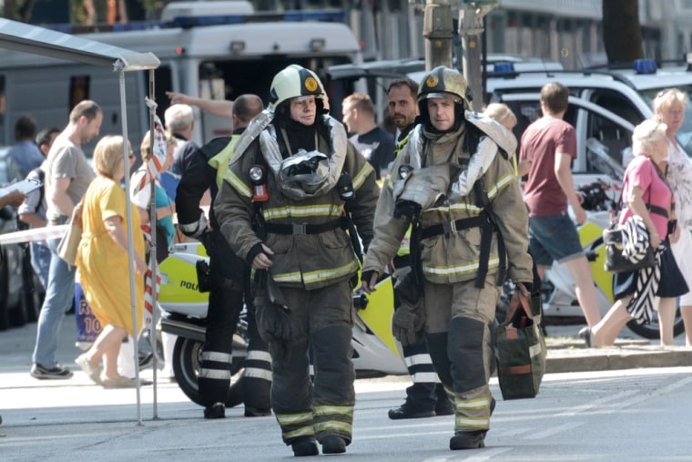 Firerfighters near the scene of the bomb scare Tuesday.
