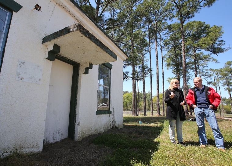 Professor Erin Kimmerle, University of South Florida's lead researcher, and U.S. Sen. Bill Nelson speak before touring the building known as the