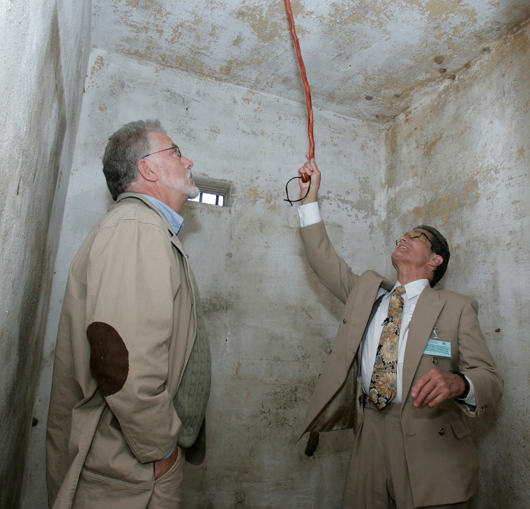 Dick Colon, right, and Mike McCarthy, left, recall their times in one of the white house rooms at the Arthur G. Dozier School for Boys during ceremonies dedicating a memorial to the suffering of the