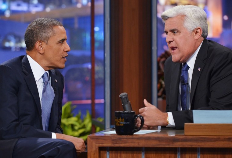 President Barack Obama talks with host Jay Leno during a taping of