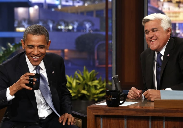 President Barack Obama sits next to Jay Leno during the taping of