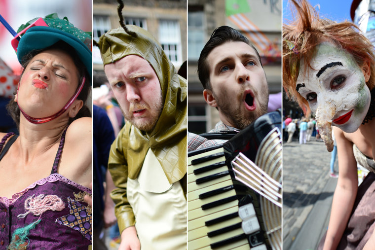 Street entertainers perform on the Royal Mile during the Festival Fringe on Aug. 7, in Edinburgh, Scotland.