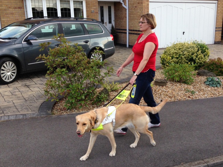 Claire Johnson is seen here with her blind guide dog.