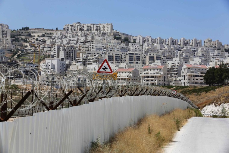 A section of the controversial Israeli barrier is seen close to a Jewish settlement near Jerusalem known to Israelis as Har Homa and to Palestinians as Jabal Abu Ghneim on July 25.