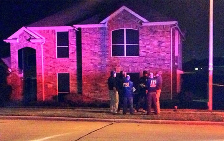 ATF and FBI agents at the scene of a fatal shooting in DeSoto that is linked to a second fatal shooting in Dallas on Aug. 8, 2013.