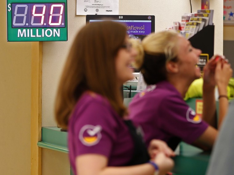 Employees chat at the Customer Service area at Stop & Shop in South Brunswick, N.J. Thursday. The supermarket is where one of the three winning Powerb...