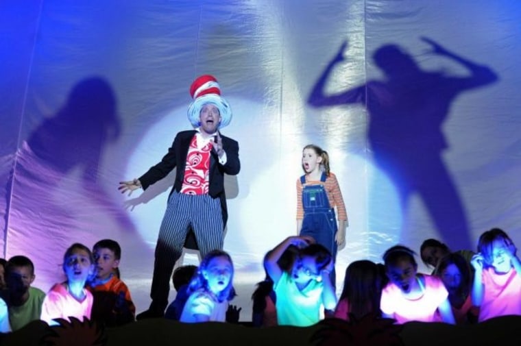 John Tartaglia, playing Cat in the Hat, and Jane Sheeran, playing JoJo, act out a scene during the dress rehearsal of Seussical at Newtown High School in Newtown, Conn. on Wednesday, August 7, 2013.