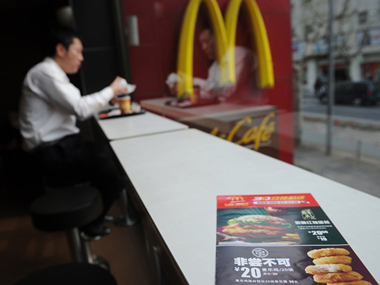A leaflet on a table in McDonald's advertises a discount on chicken McNuggets at a branch in Shanghai.