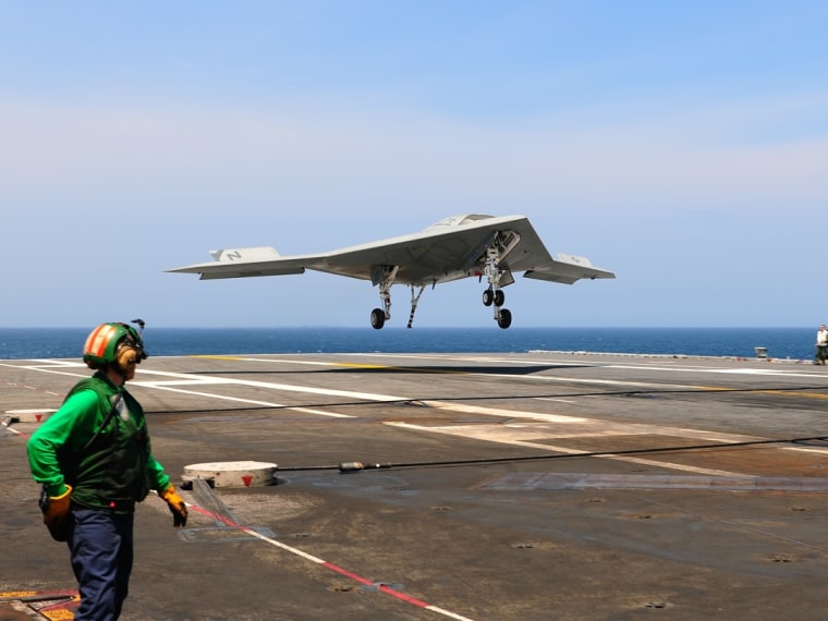 130710-N-TB177-135 ATLANTIC OCEAN (July 10, 2013) An X-47B Unmanned Combat Air System (UCAS) demonstrator completes an arrested landing on the flight ...