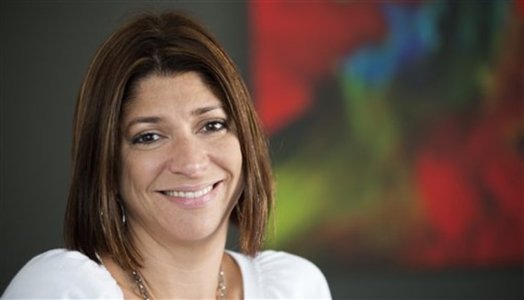 Mari Torres, 39, poses for a picture in her office in Springfield, Va., Thursday, Aug. 1, 2013. Each year, consumers return about $264 billion worth o...