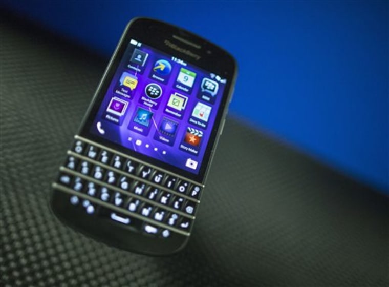 FILE - In this Tuesday, July 9, 2013 file photo, a BlackBerry Q10 appears on display at the company's Annual and Special Meeting, in Waterloo, Ontario...