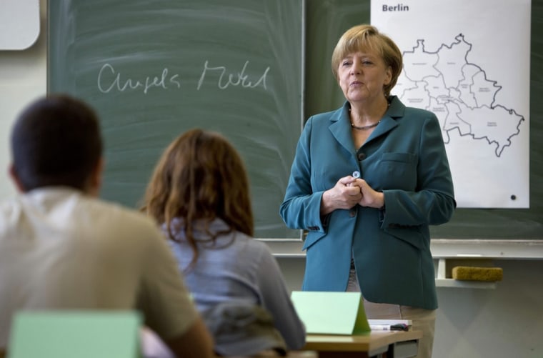 German Chancellor Angela Merkel in front of her class in Berlin, Tuesday.