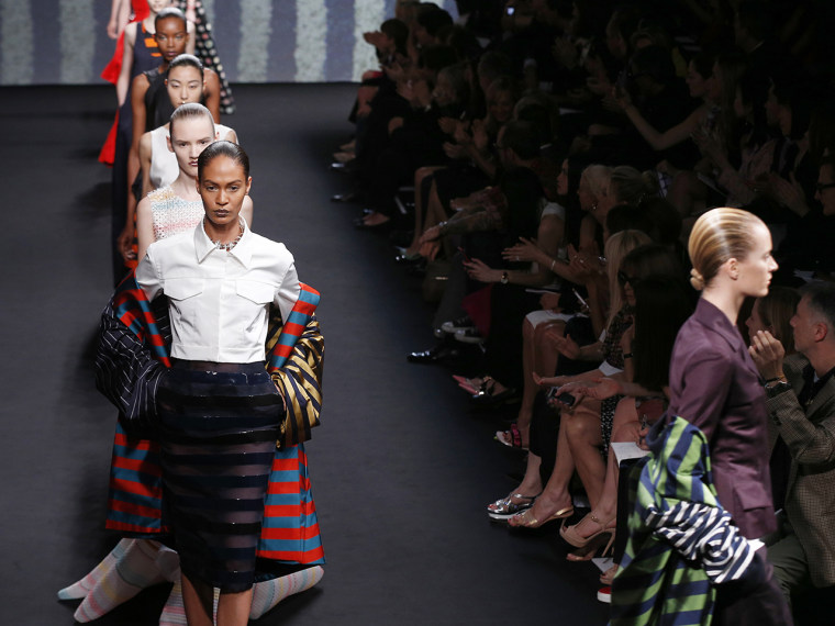 A diverse group of models present creations for Christian Dior during the Haute Couture Fall-Winter 2013/2014 collection shows, on July 1, 2013 in Paris.