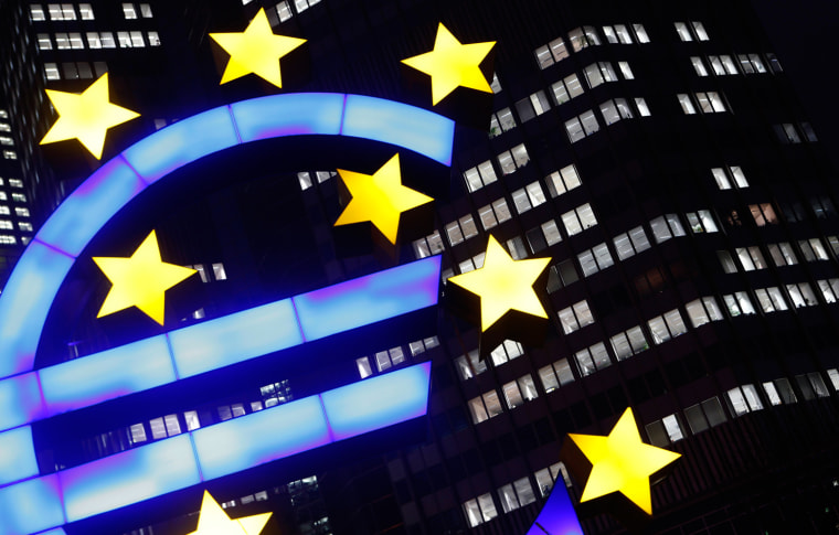 File picture shows an illuminated euro sign in front of the headquarters of the European Central Bank (ECB) in the late evening in Frankfurt January 8...