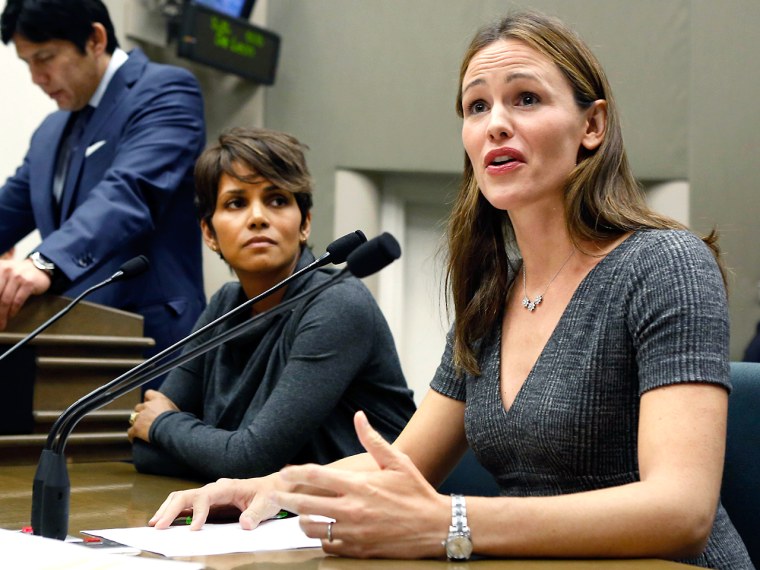 Actress Jennifer Garner, right, describes how paparazzi aggressively follow her and her three children daily, while testifying before the Assembly Jud...