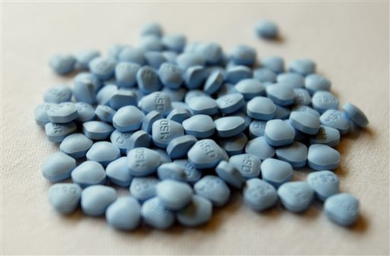 FILE - Tables of the drug finasteride are displayed outside of a news conference given by the National Cancer Institute in Washington, Tuesday, June 2...