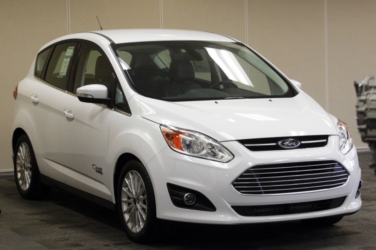 A 2013 Ford C-MAX Energi is on display during a news conference to mark the official production launch of the vehicle at the Michigan Assembly Plant i...