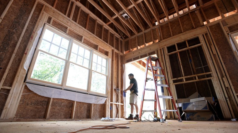 epa03797598 Electrician Steve Hayes works in a new home under construction in Avondale Estates, Georgia USA, 22 July 2013. According the US Census bur...