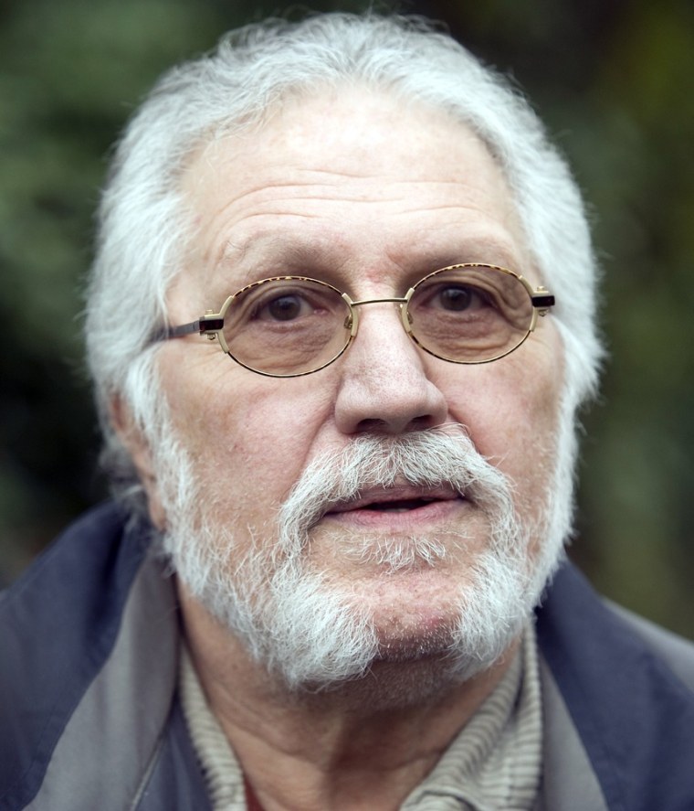 Dave Lee Travis speaks to reporters outside his home on November 16, 2012.