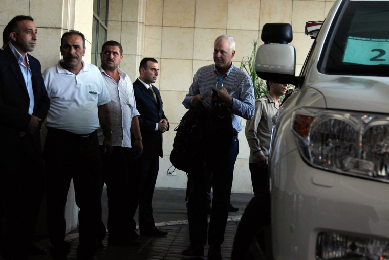 Ake Sellstrom (R) the head of a U.N. chemical weapons investigation team arrives in Damascus August 18, 2013.
