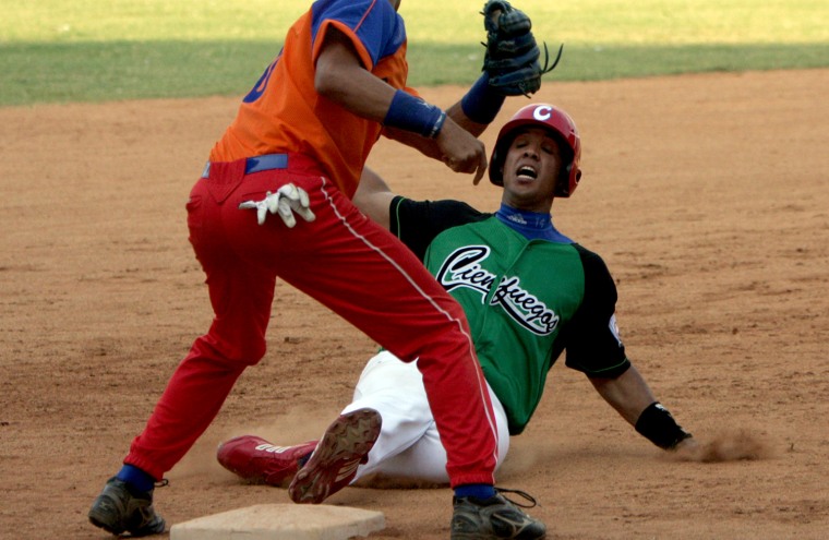 Jose Dariel Abreu is tagged out at third base during a training match of Cuba's National Baseball team in 2009.