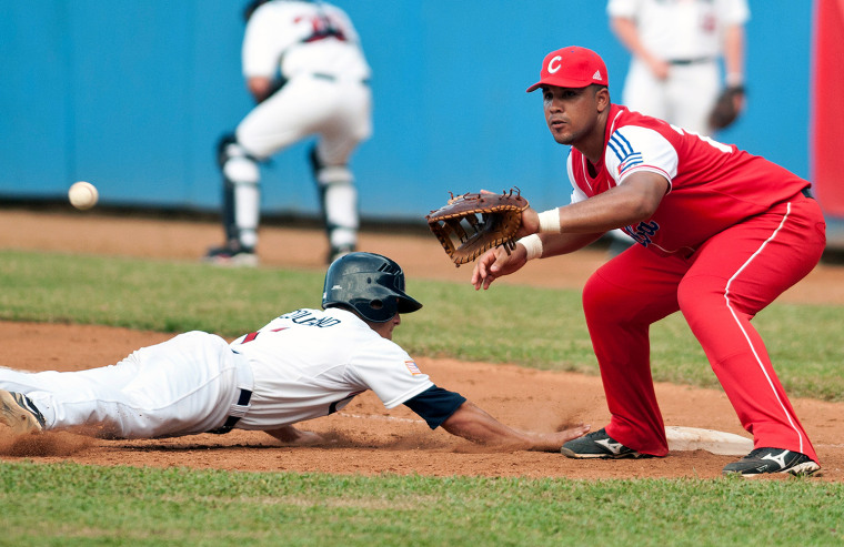 Jose Dariel Abreu and an American youth player, Brett Hambright, during a friendly match in Cuba last year.