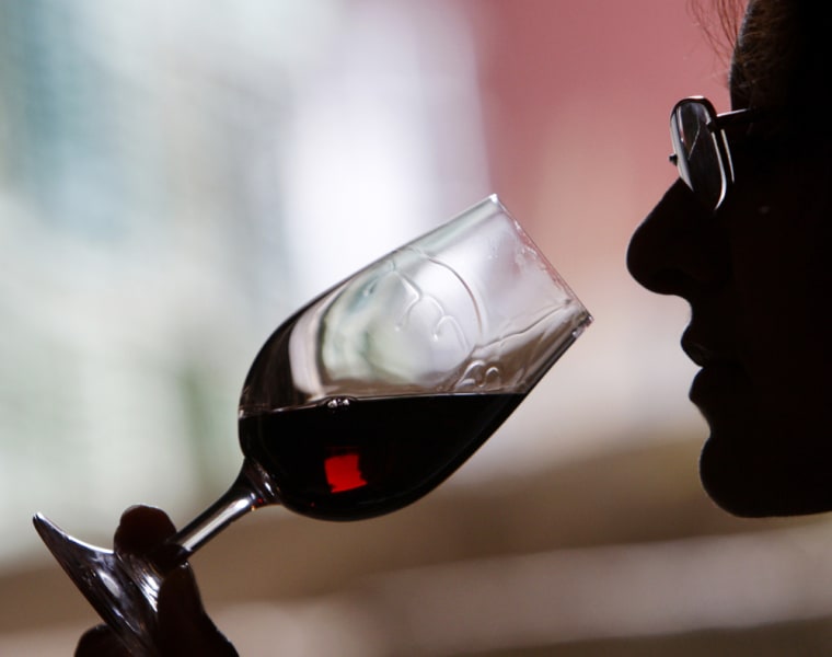 A wine selector tastes red wine from the latest vintage at Bonini winery's wine-cellar in the village of Brestovitsa, about 150km (93miles) east of th...